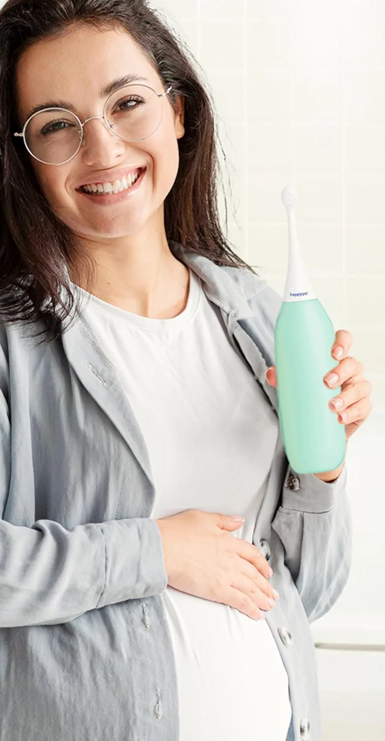 A pregnant woman holding the mint HappyPo bottle